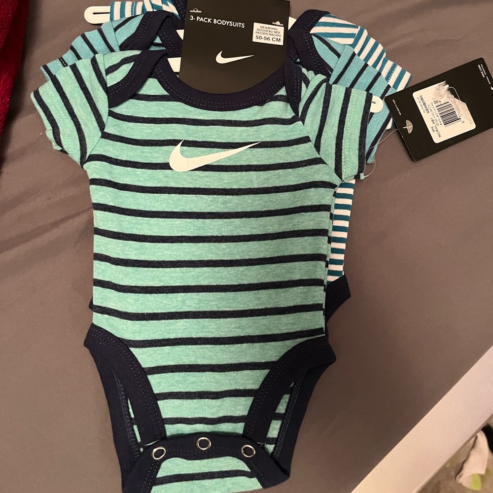 Brand new with tags newborn Nike onesies (6total) never worn